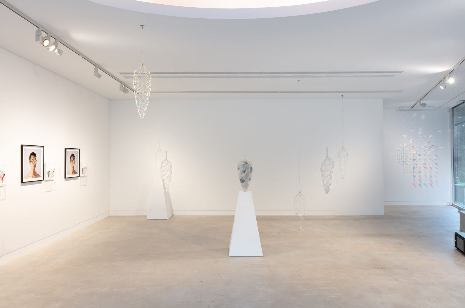 Installation view, Connectivity: New Explorations, Gallery Sally Dan-Cuthbert, 2023: Dimensions of the Mind on plinth, suspended vessels, mask prints on left wall.