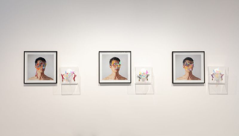 Installation view, Connectivity: New Explorations, Gallery Sally Dan-Cuthbert, 2023: Dichroic Glass Mask I-III prints with the Seeing beyond the memories masks.